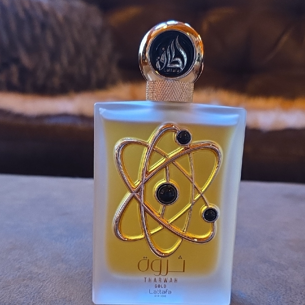 Lattafa Tharwah Gold Perfume for Women - 3.4 fluid ounces.